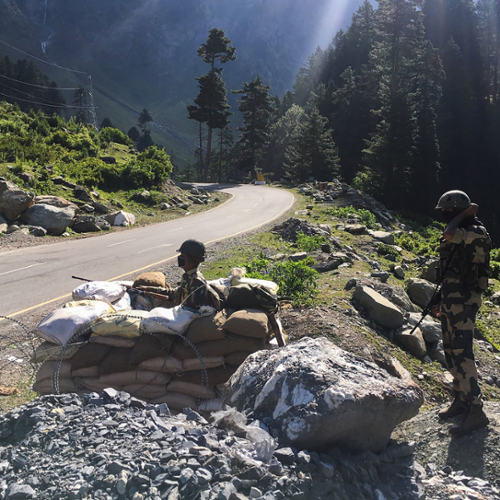 Indian soldiers monitor a road in the Himalayas.