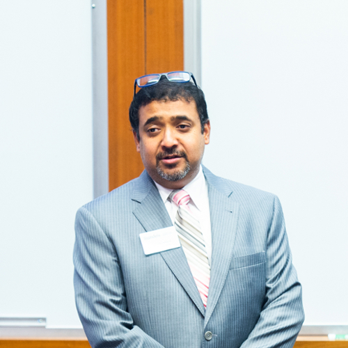 A photo of Prof. Debarshi Nandy in a lecture hall.
