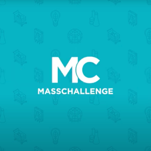 The MassChallenge logo over a green background.
