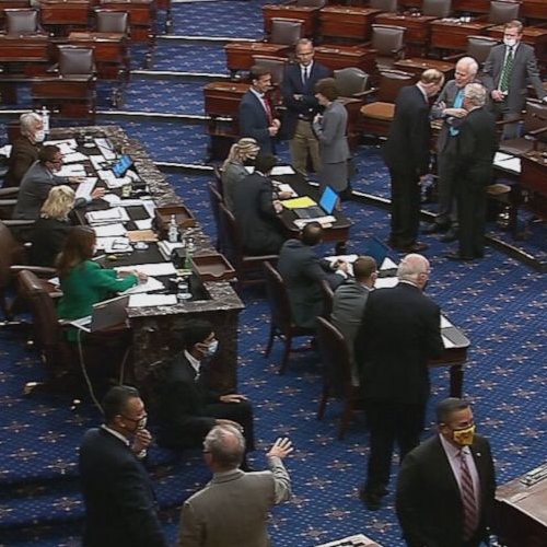 A screenshot taken from a video depicting lawmakers on the Senate floor voting to raise the debt ceiling in October of 2021