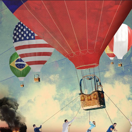 Hot air balloons floating with various countries' flags.