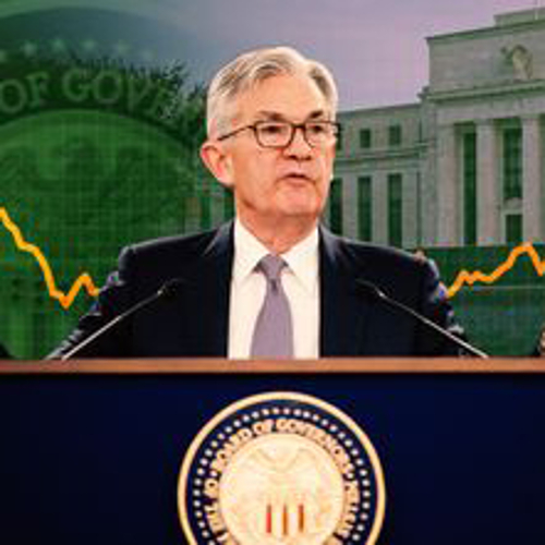 A picture of Fed Chair Jerome Powell at a podium with the seal of the Federal Reserve as a background.