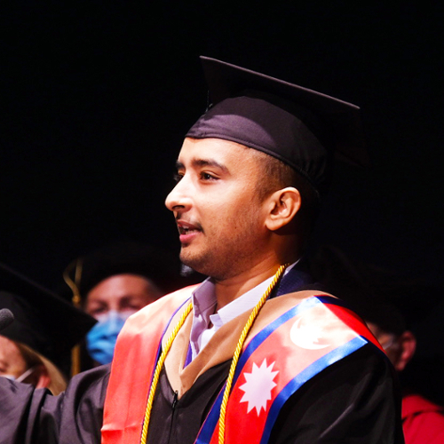 A portrait of Ishan Adhikari.