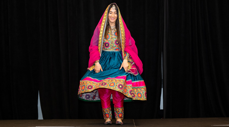 A student in colorful Afghan dress.