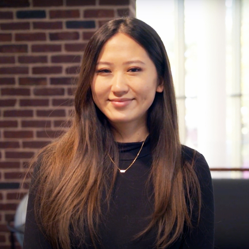 A portrait of Christiana Wang in a black sweater.