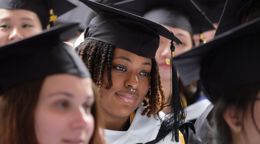 Graduates gathered inside the Gosman Sports and Convocation Center for commencement.