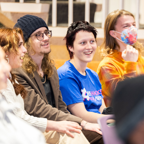 Students in the winning hacker group celebrate as the winners are announced.