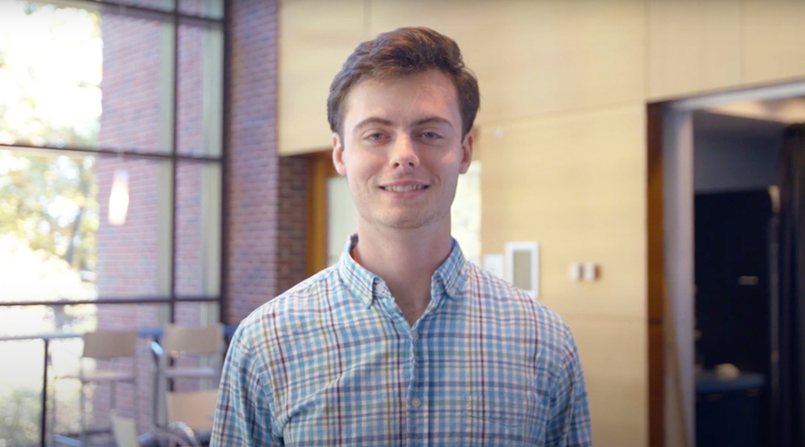 A portrait of Evan Goddard with the Sachar cluster in the background.