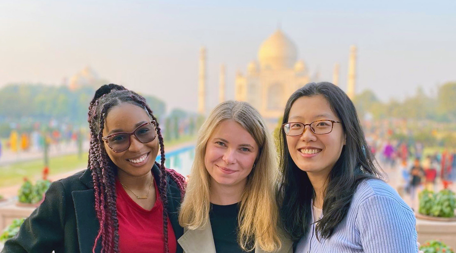 Djounia Saint-Fleurant, MBA’24, left, with classmates at the Taj Mahal.