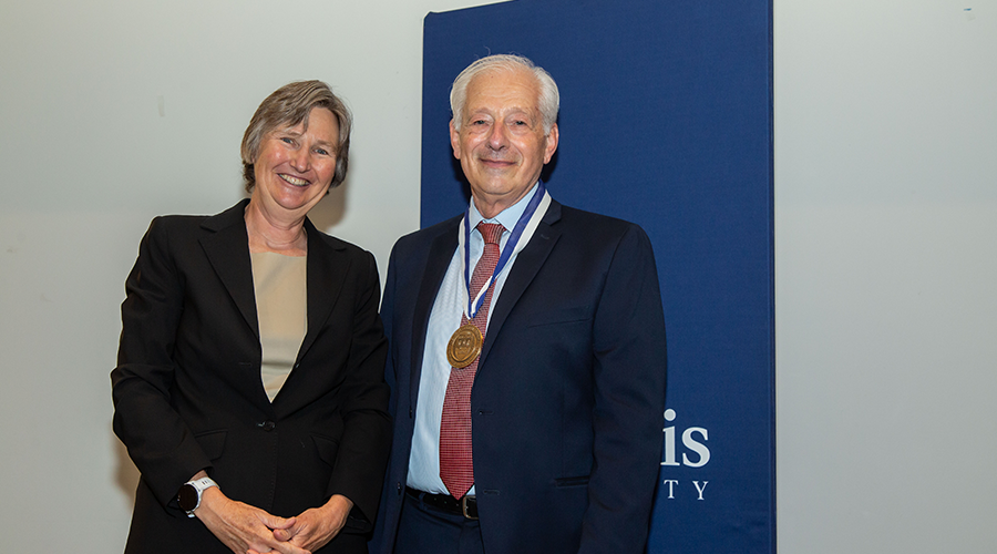 Dean Kathryn Graddy and Dean’s Medal recipient Peter Petri.