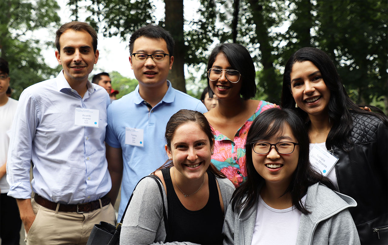 six smiling students at orientation