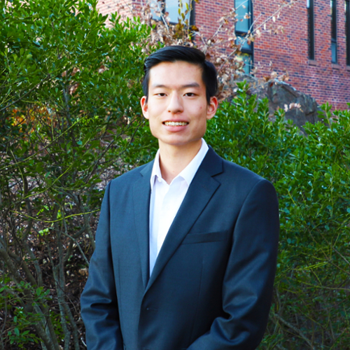 A portrait of Brian Hsieh in a blue jacket and white shirt.