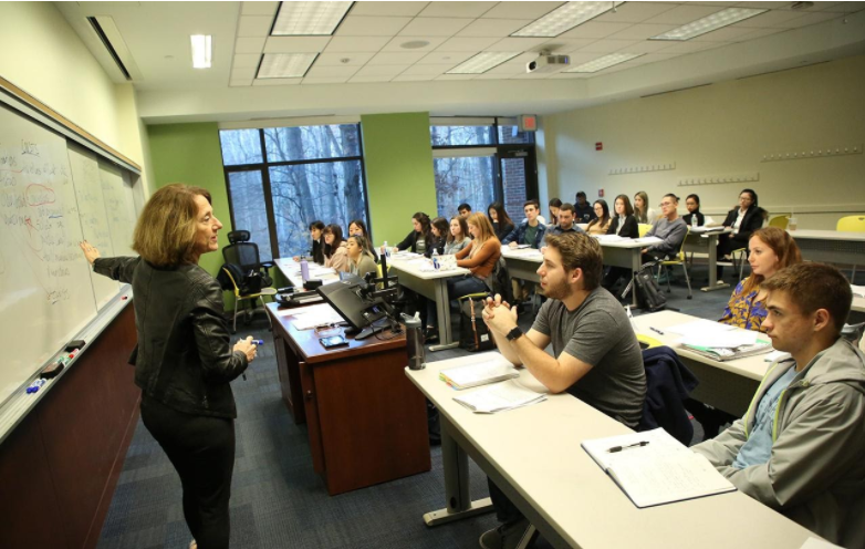 professor pointing to board 