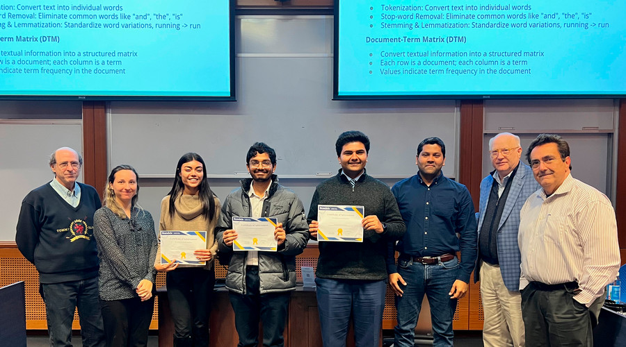 Student winners of the datathon pose with their plaques with the professor and judges.