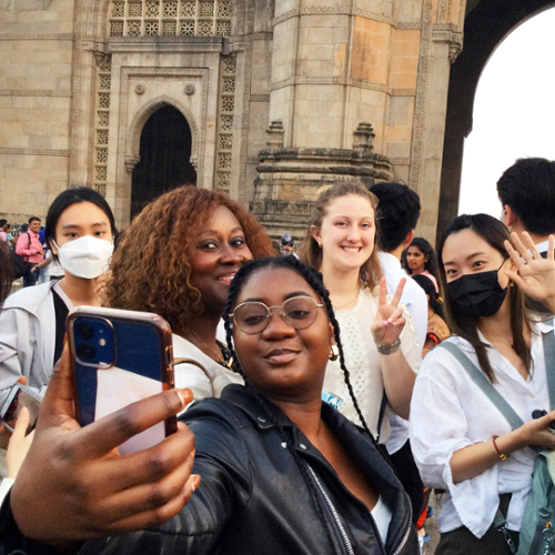 Students take a selfie in front of the Chhatrapati Shivaji Terminus train station in Mumbai.