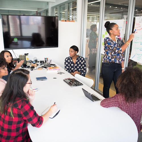 Students working in conference room