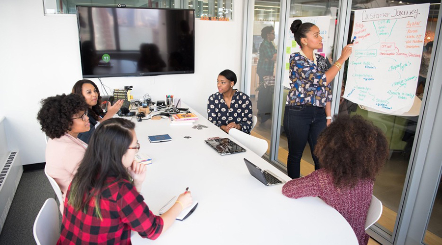 Students working in conference room