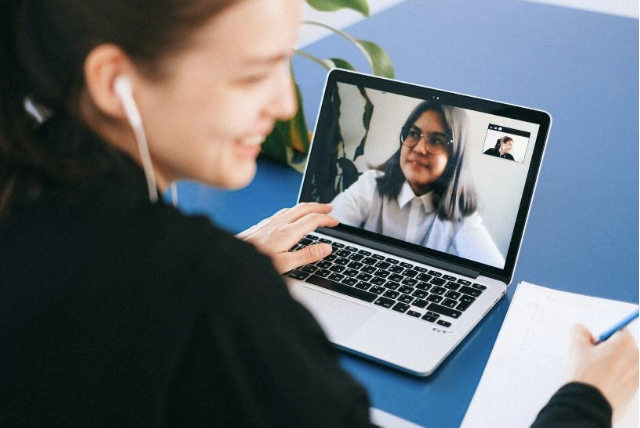 Someone on their computer on a video conference