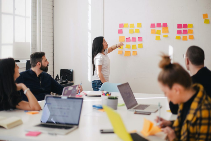 Professionals collaborating on a project in a conference room