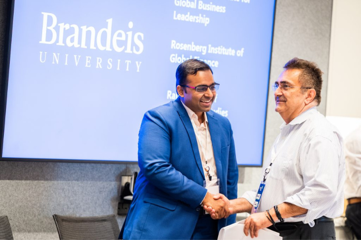 Panelist Sasidhar Sista and Professor Ahmad Namini greet one another before the panel “Global Fintech Spotlight.” Photo by Ashley McCabe.