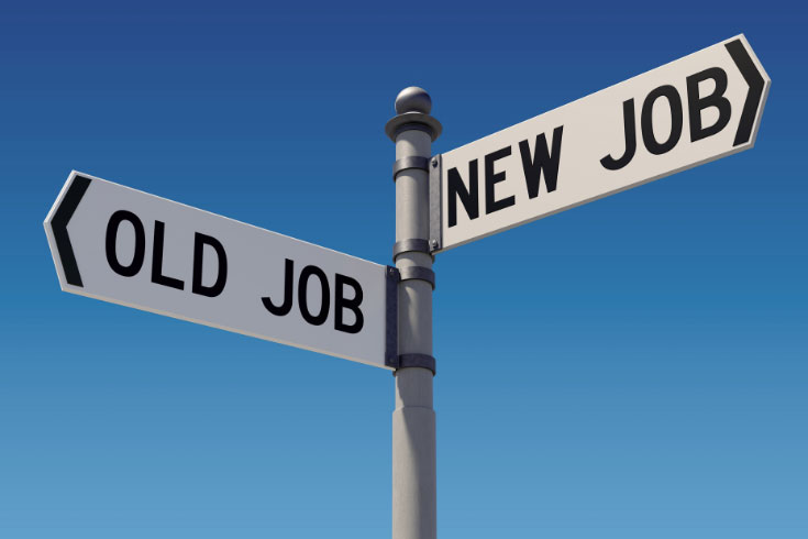 Street signs against a clear blue sky pointing in opposite directions: new job and old job