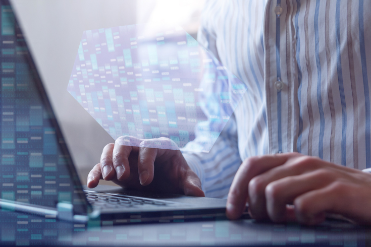 Person typing at computer with binary code and images representing DNA overlayed.