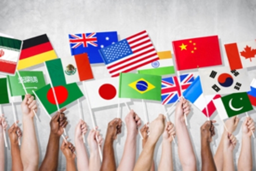 Hands holding flags from various countries