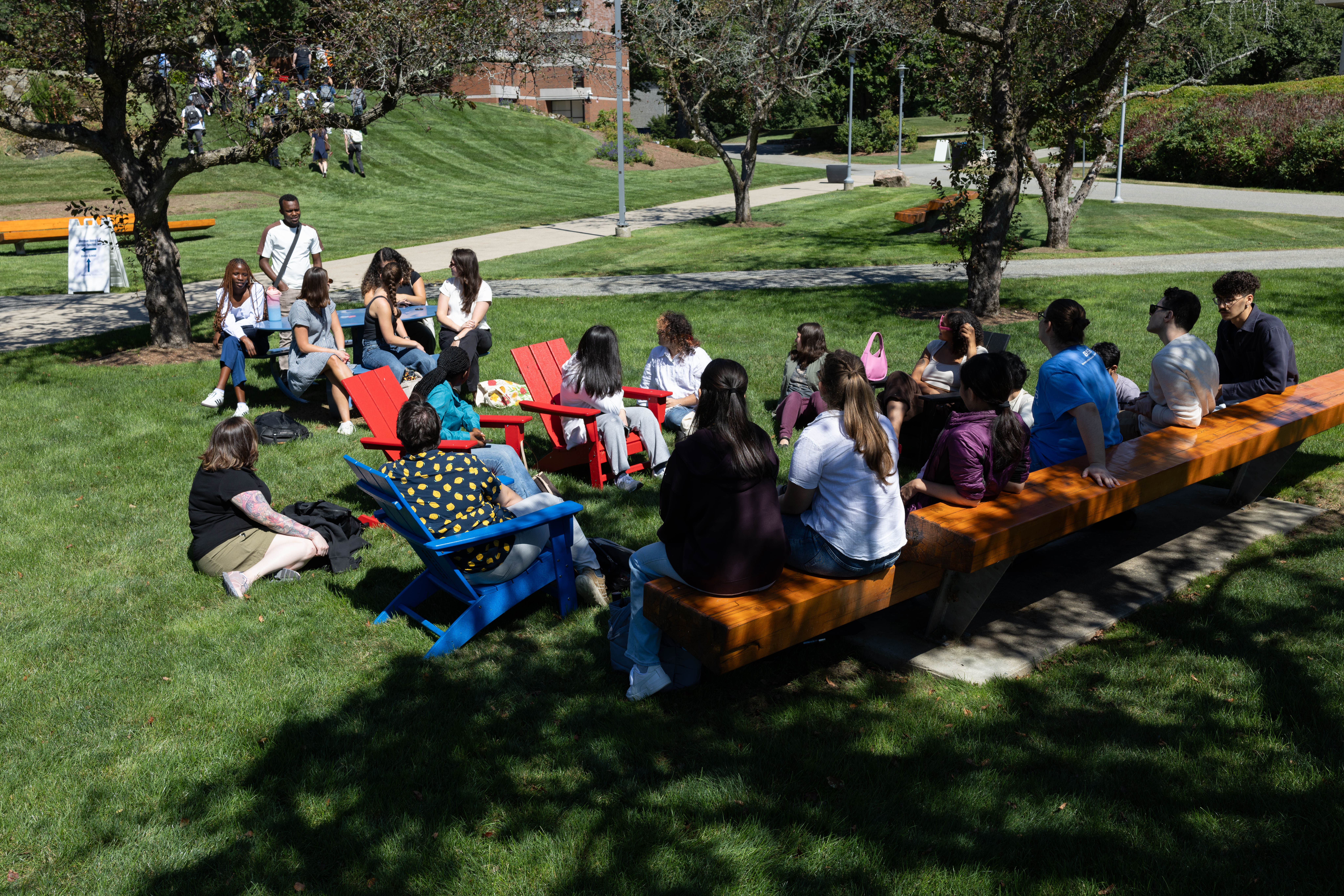a small group of student talking and laughing 