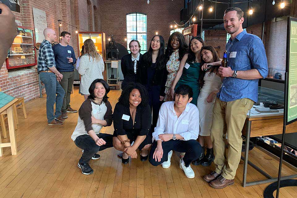 A group of students stand in a group posing.