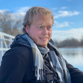 Will Dahl sits by a river.