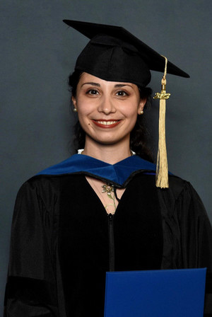 Shirah Malka Cohen poses in graduation cap