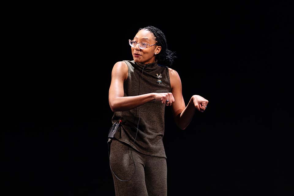 Jillian E. Franks mimes pushing a cart.