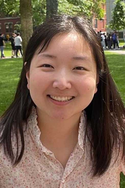 Dohyun Kim in front of a grassy field