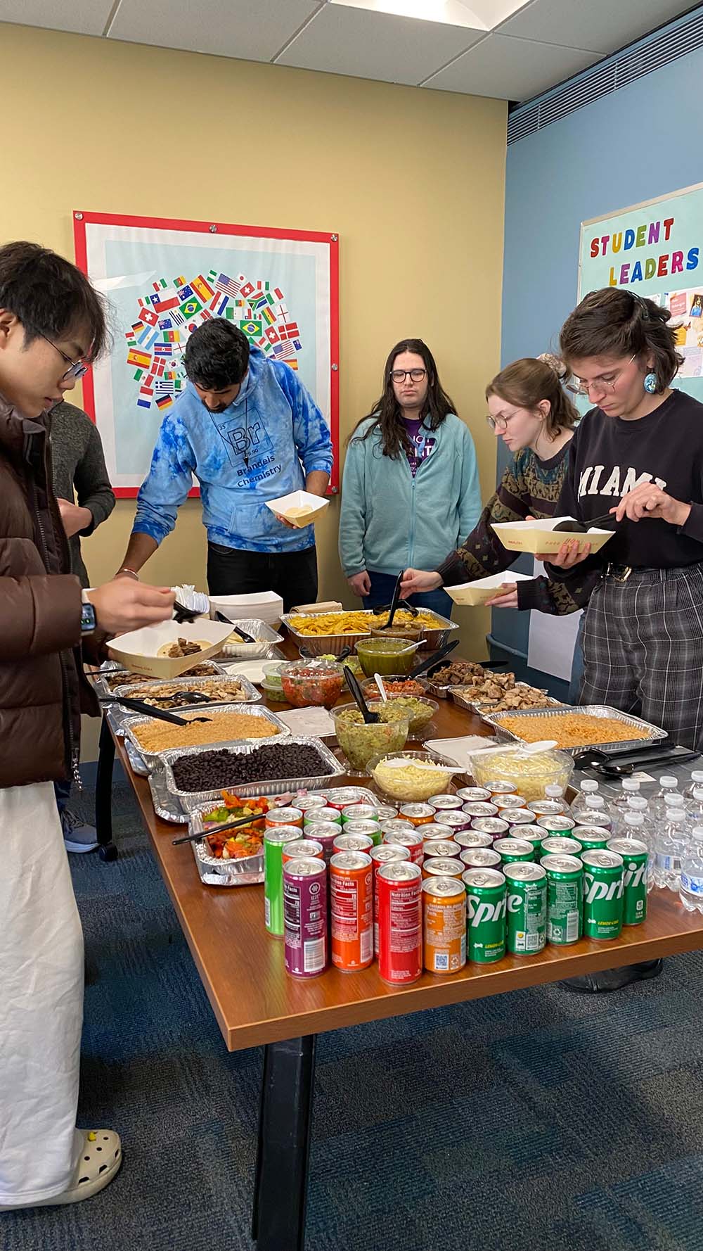 Students serve themselves from a taco bar.