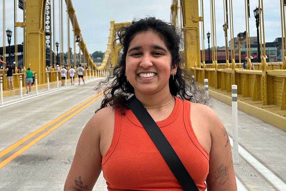 Neerja Garikipati stands on a bridge.
