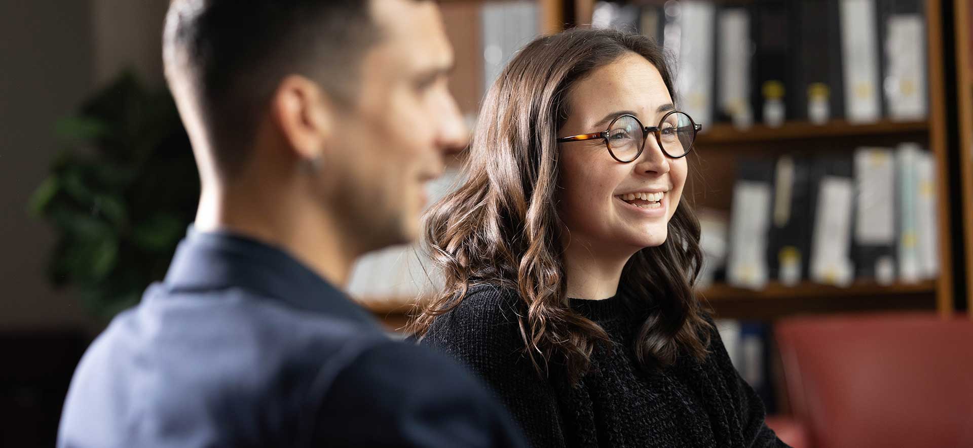 Graduate students smiling in a classroom