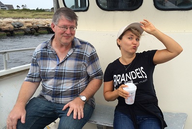 Curt Woolhiser and Irina Dubinina smiling on a boat