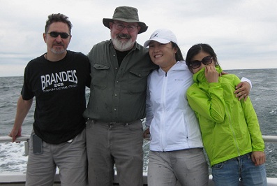 David Powelstock, Steve Dowden, Xiwen Lu and Jian Wei. smiling on a boat