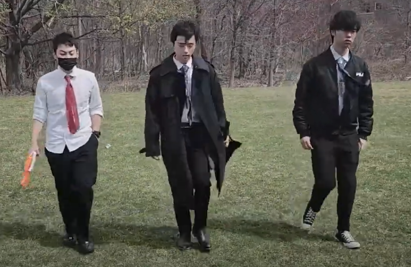 three students walking from video