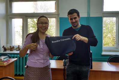 Rossina Soyan and Matt Kupfer holding Brandeis University swag