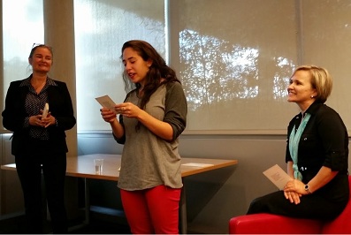 Vera Pavlova (left) and Professor Irina Dubinina (right) listen as a student reads one of Ms. Pavlova's poems in translation.