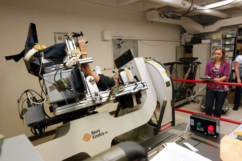 A subject being swung in multiple directions in the Graybiel Lab Spinning Space Chair.