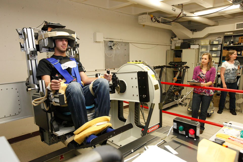 A subject being swung in multiple directions in the Graybiel Lab Spinning Space Chair