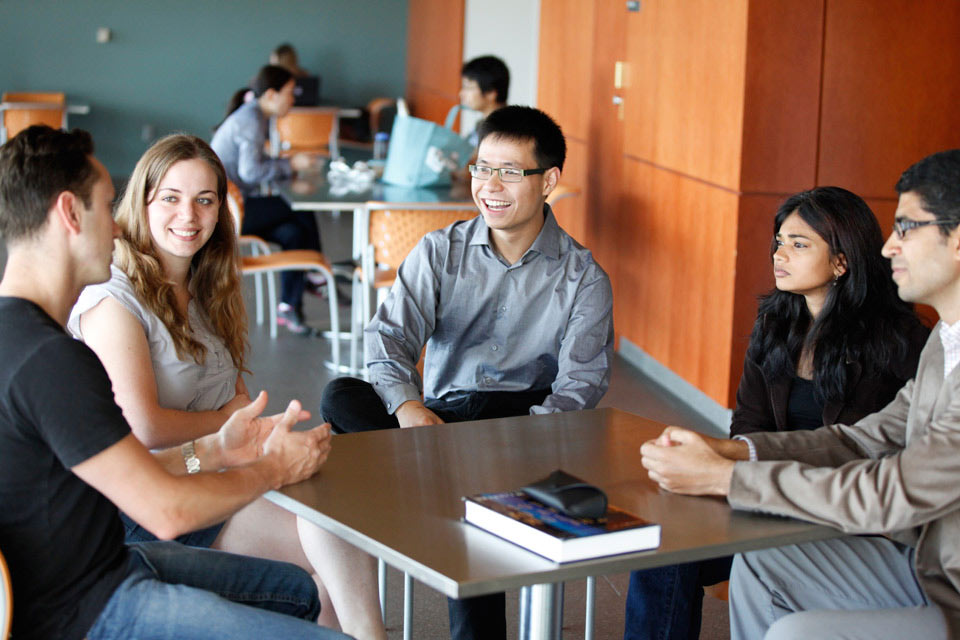 students talking at a table