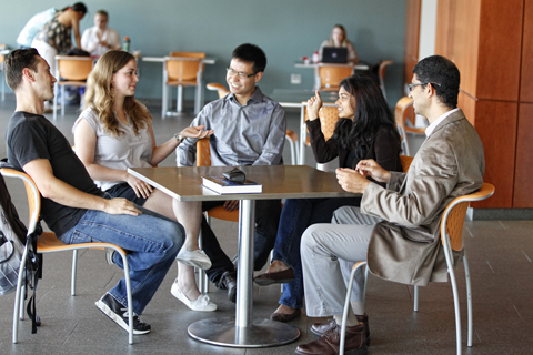 Students talking at a table