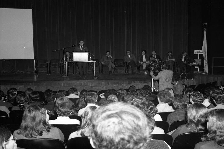 Brandeis community gathered in a theatre to hear Vietnam War protests.