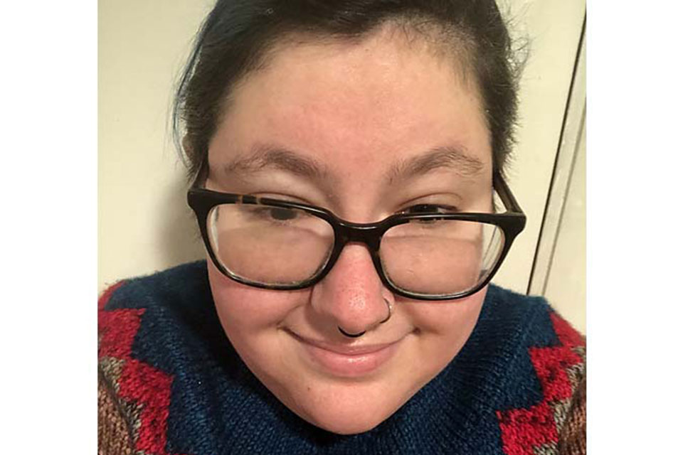 Cat Rosch wears a colorful sweater.