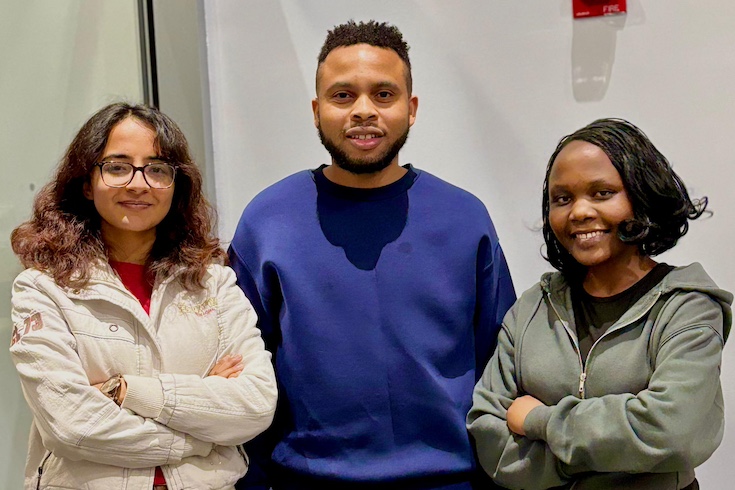 Anjila Pandey, Ratherford Njanji, and Eunice Ingabire stand in a line.