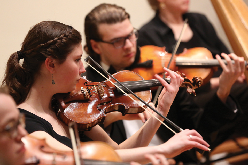 students playing string instruments