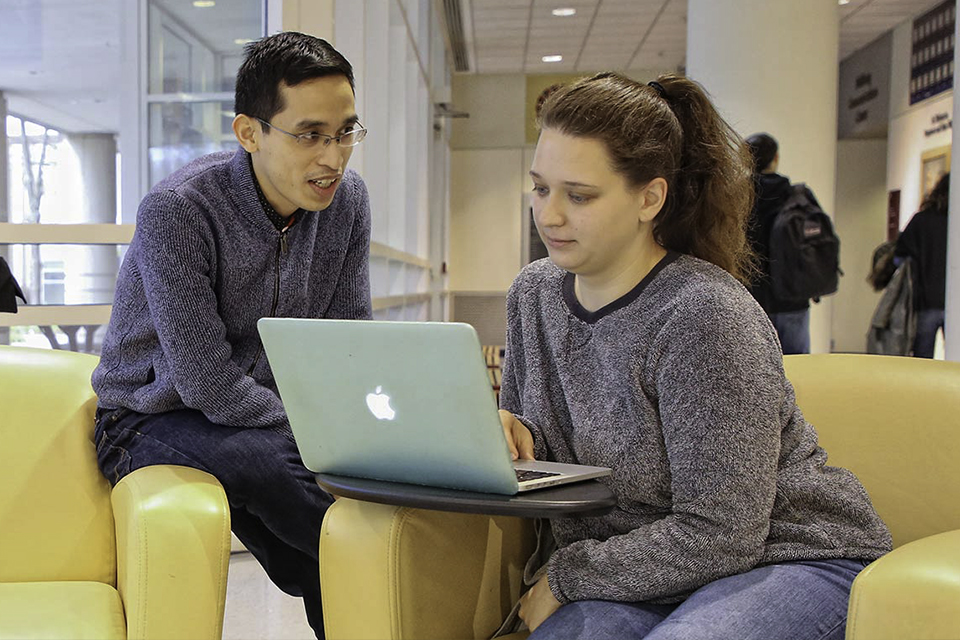 student and professor collaborating